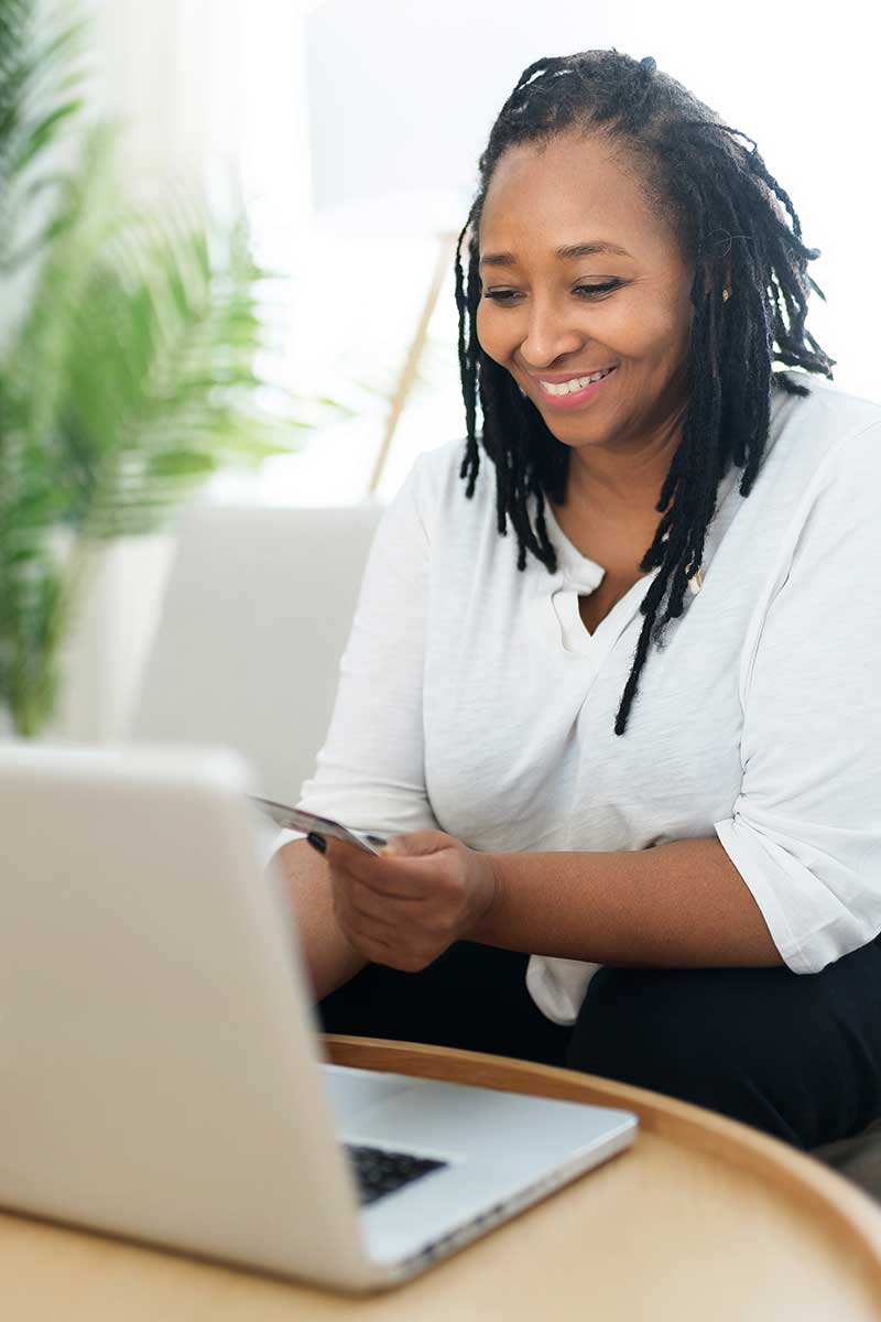 African American woman completing Vitality Infusions IV Therapy health and safety forms